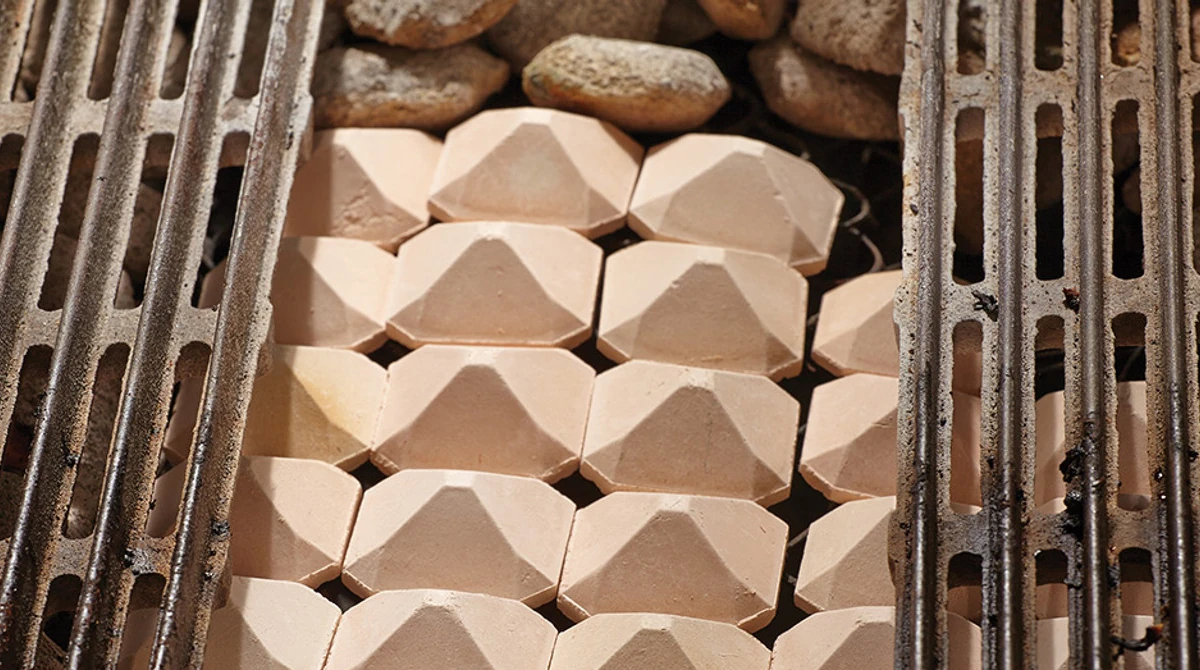 Grill with briquettes.