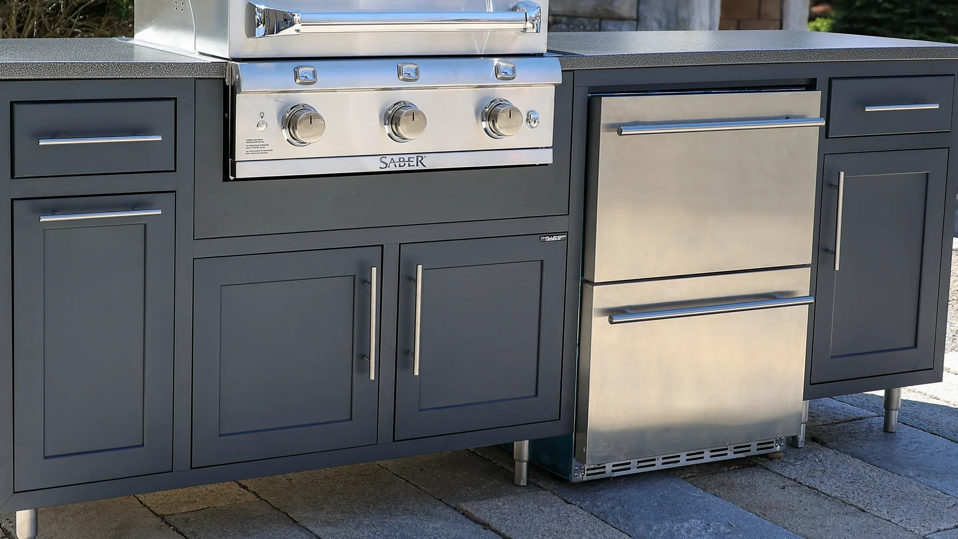 A zoomed in shot of a grill with multiple doors.