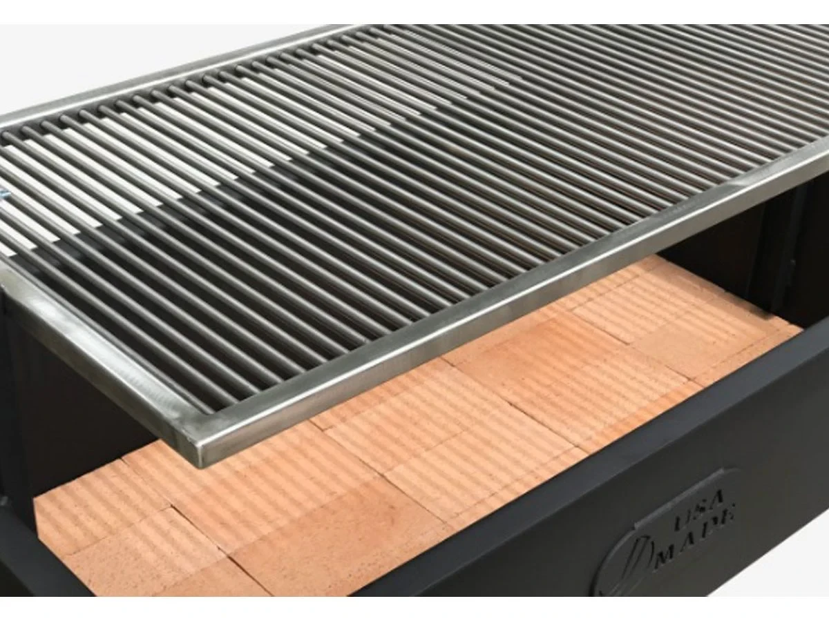 New grates being installed on a grill.